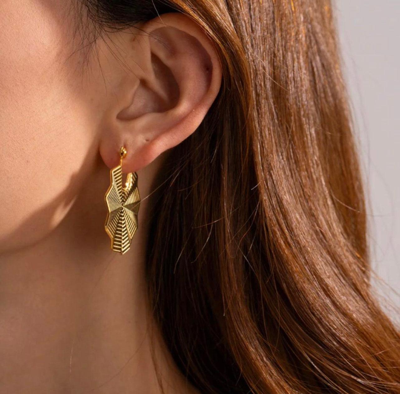 Cascading Lace Fan Earring on a model